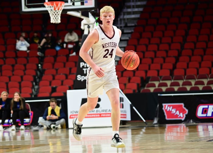 Western Christian's Kaden Van Regenmorter dribbles up the court against Treynor during a Class 2A state tournament semifinal at Wells Fargo Arena in Des Moines on Thursday. (Photo by Ryan Timmerman)